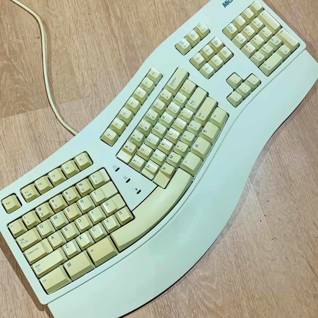 Vintage Microsoft Natural Keyboard with ergonomic design.