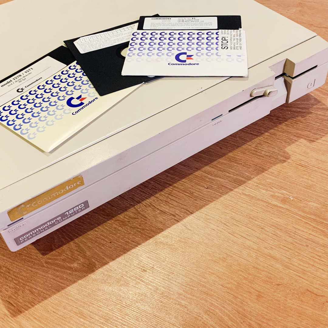 Commodore 128D Personal Computer with floppy disks.