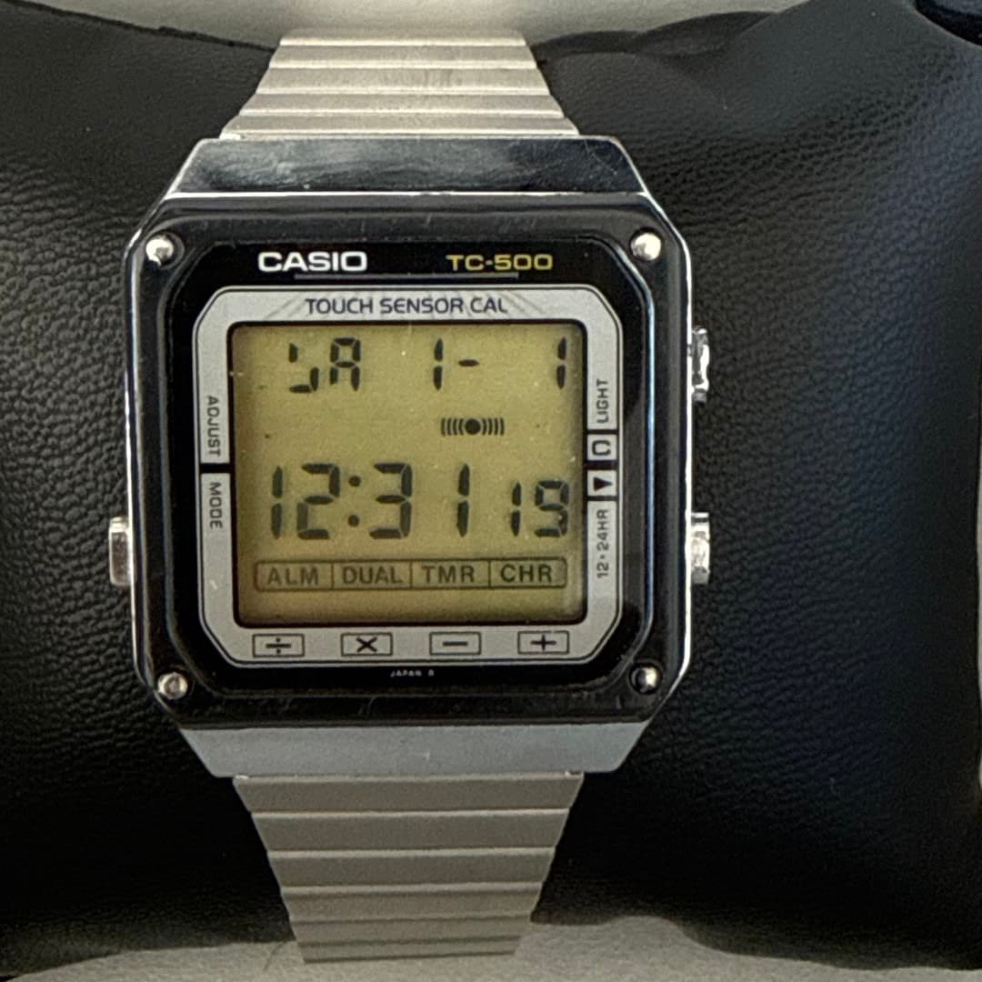 Vintage Casio TC-500 touch sensor digital watch with metal band.