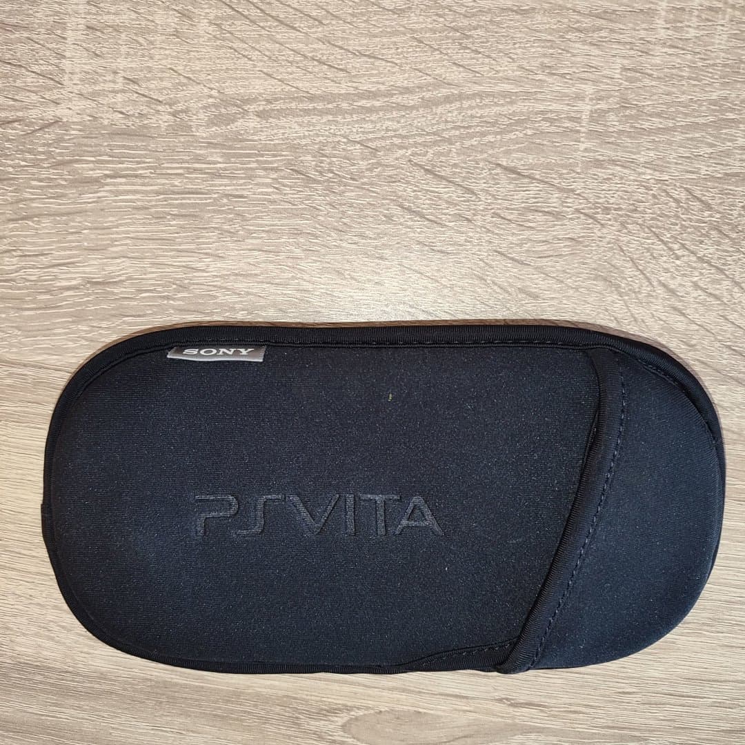 A black Sony PS Vita carrying case. PCH-1104