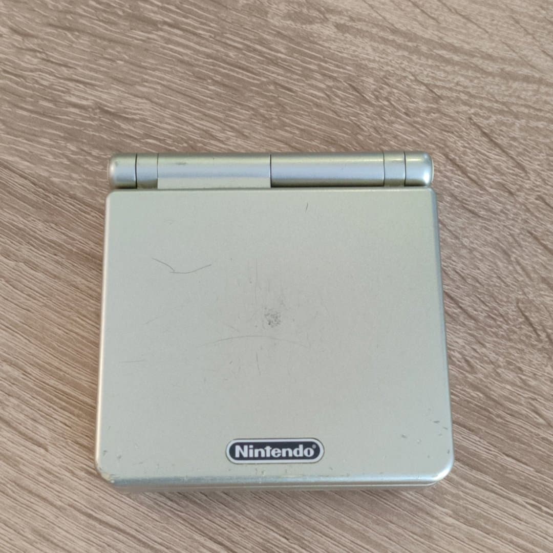 Silver Nintendo Game Boy Advance SP handheld console. AGS-101