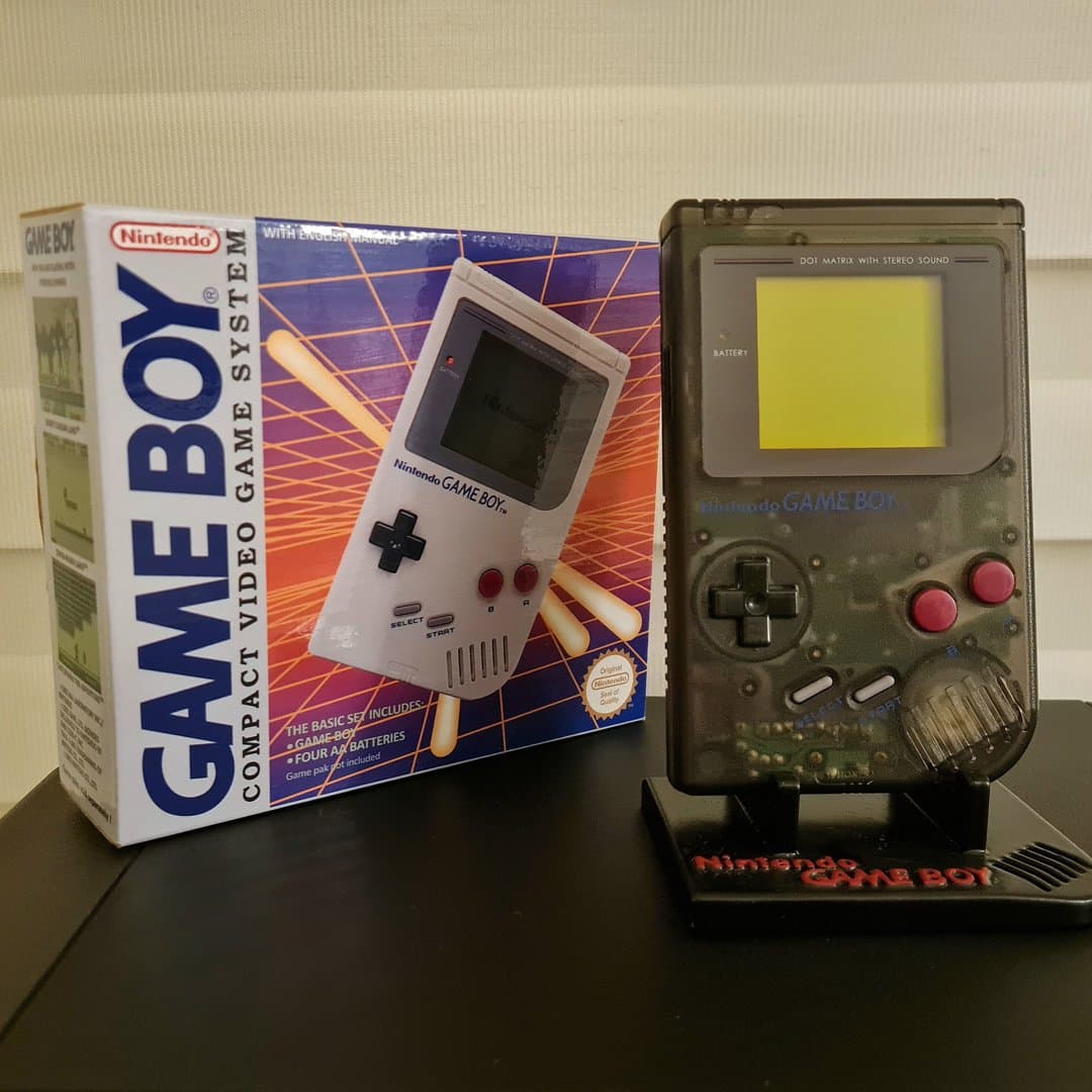 Original Nintendo Game Boy with box and stand.