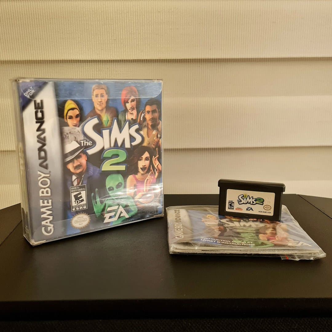 The Sims 2 for Game Boy Advance, complete with box, cartridge, and instruction manual.