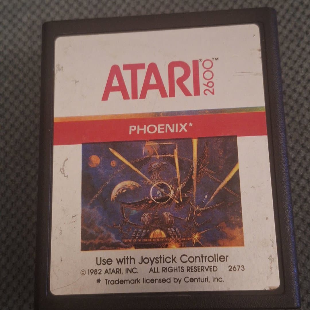 Atari 2600 Phoenix game cartridge, a classic 1982 arcade shooter.