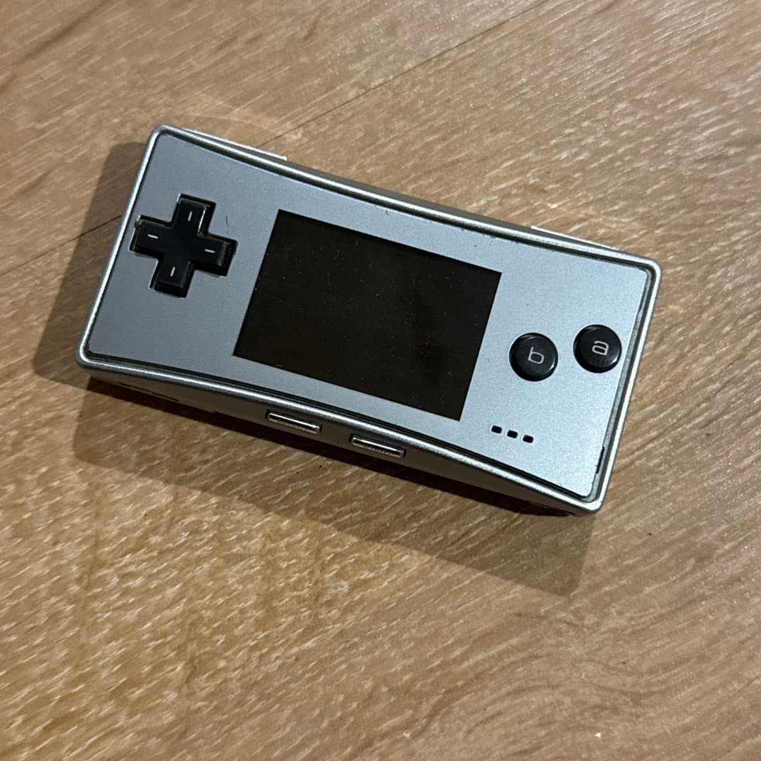 Silver Game Boy Micro handheld console.