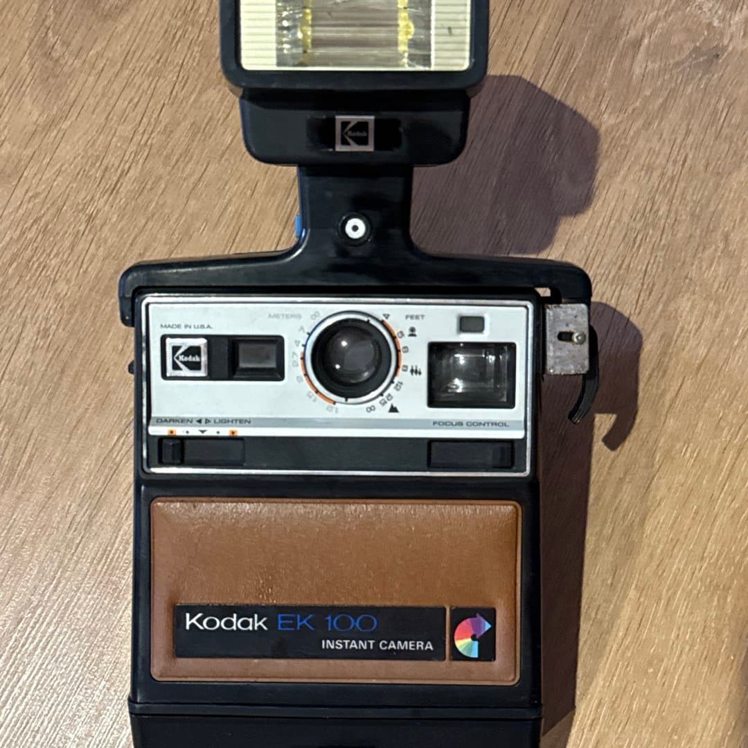 Kodak EK 100 vintage instant camera with an attached flash unit, made in USA.