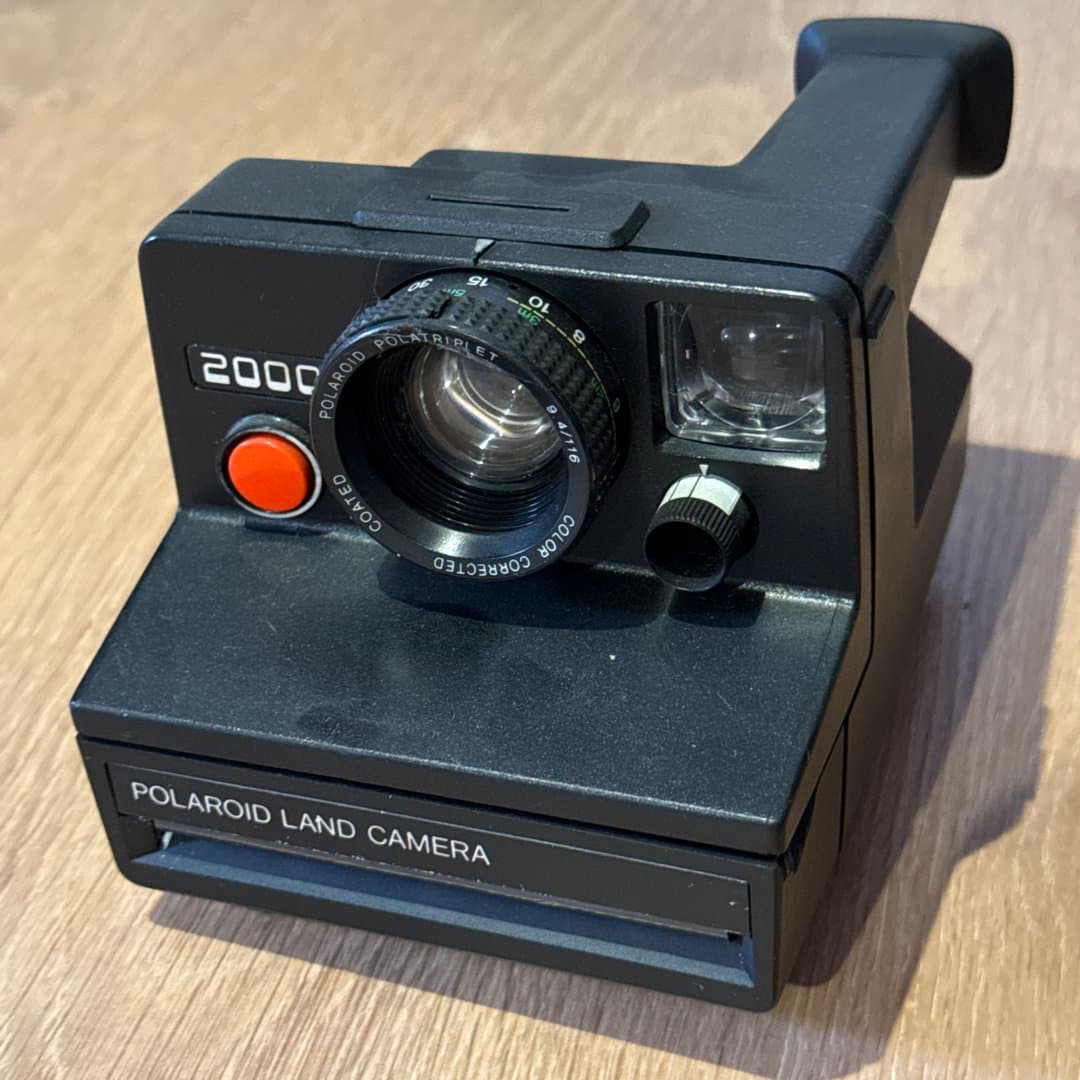 Vintage Polaroid 2000 Land Camera, an iconic instant film camera for nostalgic prints.