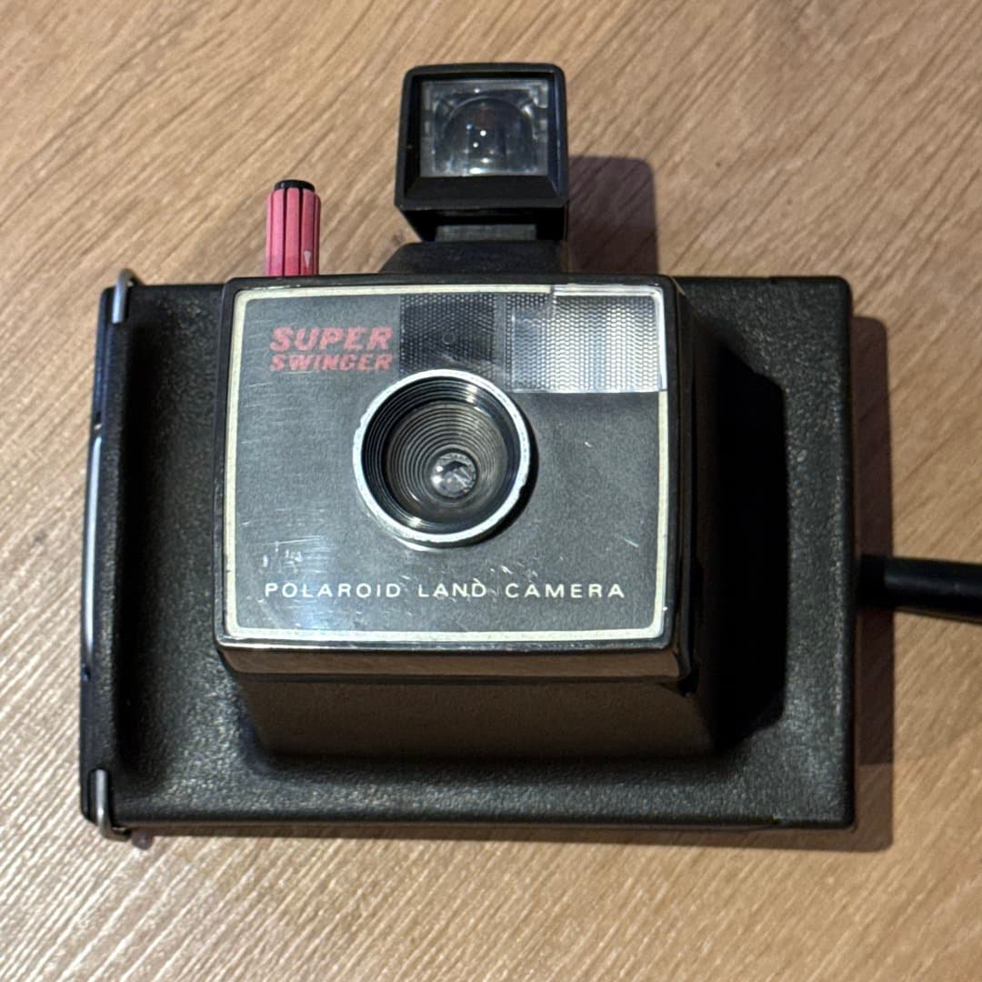 Vintage Polaroid Super Swinger Land Camera for instant photography.