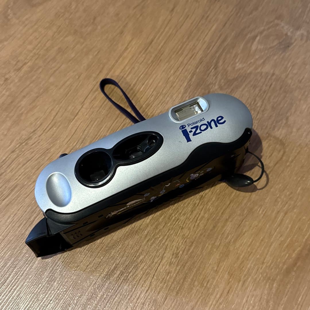 Polaroid i-Zone compact film camera, a vintage point-and-shoot for instant or traditional photography.