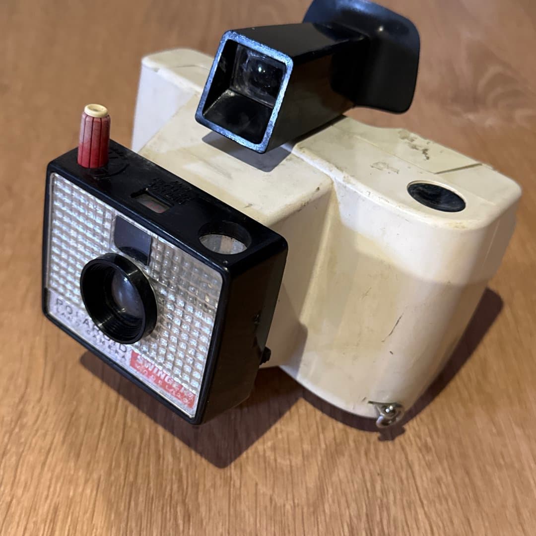 Vintage Polaroid Swinger instant camera, a classic from the 1960s.