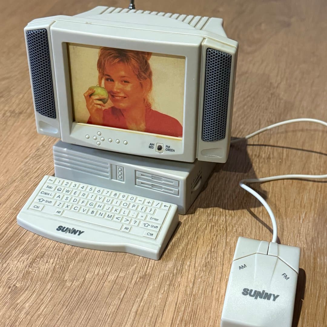 Retro computer-shaped AM/FM radio with a built-in photo frame by Sunny.