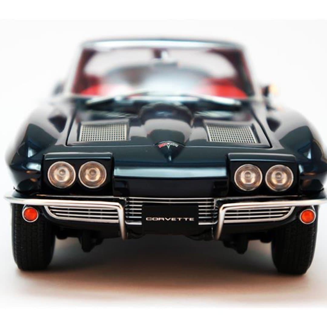 Detailed model of a classic dark green Chevrolet Corvette Sting Ray, perfect for collectors.