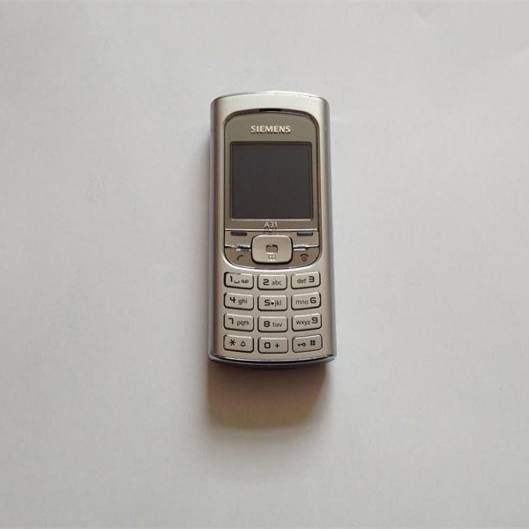 Vintage Siemens A31 feature phone with physical keypad and monochrome display.