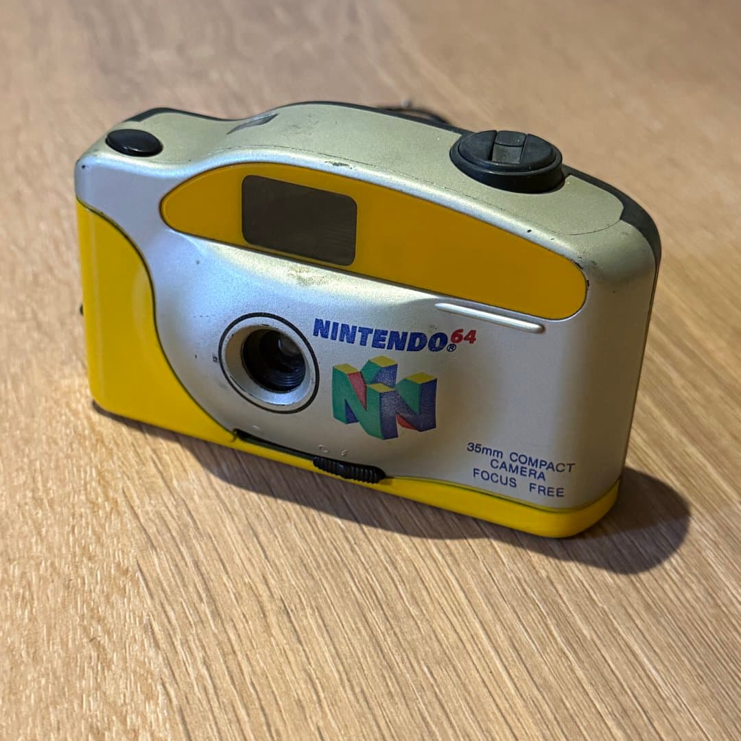 A vintage Nintendo 64 branded 35mm compact focus-free film camera. - Photo 1