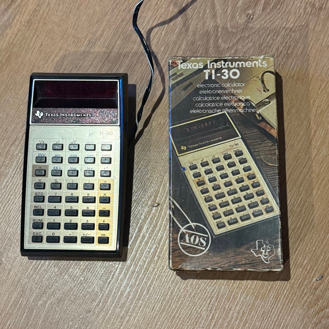 Vintage Texas Instruments TI-30 scientific calculator with its original box. - Photo 1