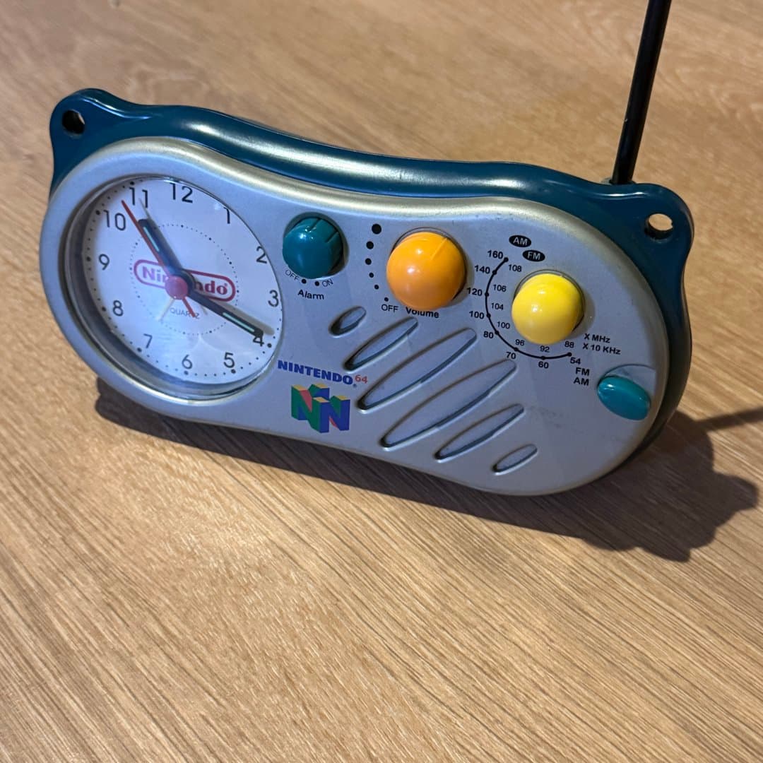 Retro Nintendo 64 alarm clock with built-in AM/FM radio. - Photo 1