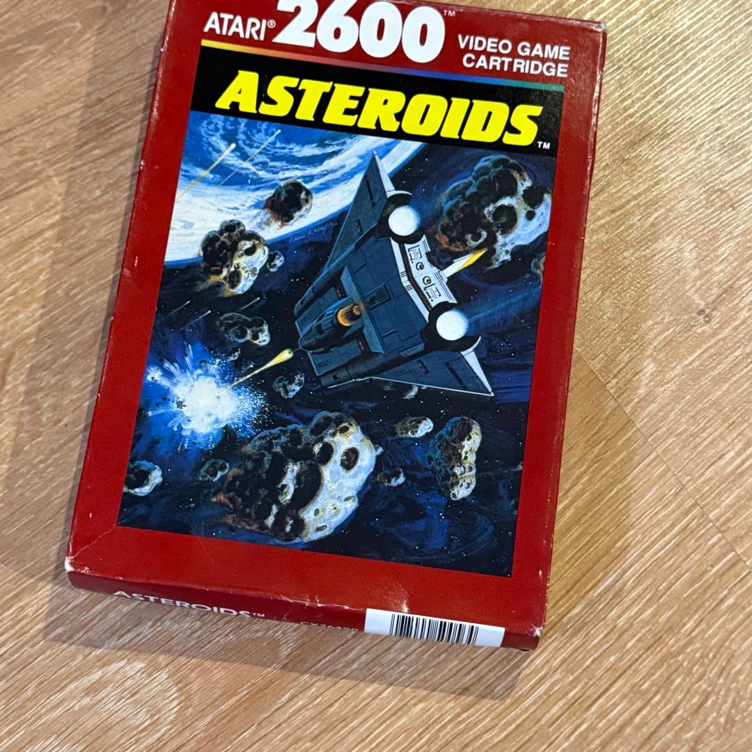 Classic Atari 2600 "Asteroids" video game cartridge in its original box.