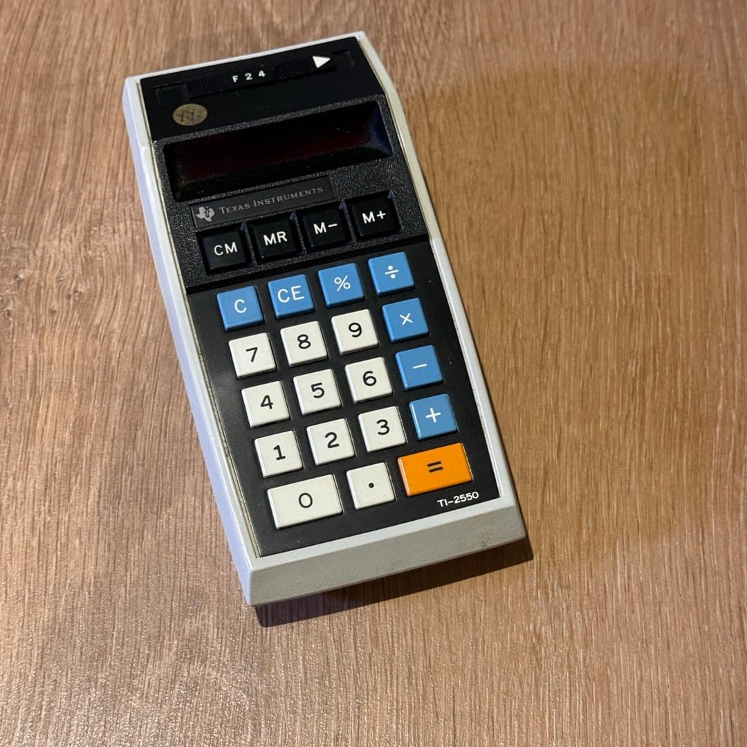 Vintage Texas Instruments TI-2550 electronic calculator with classic button layout. - Photo 1