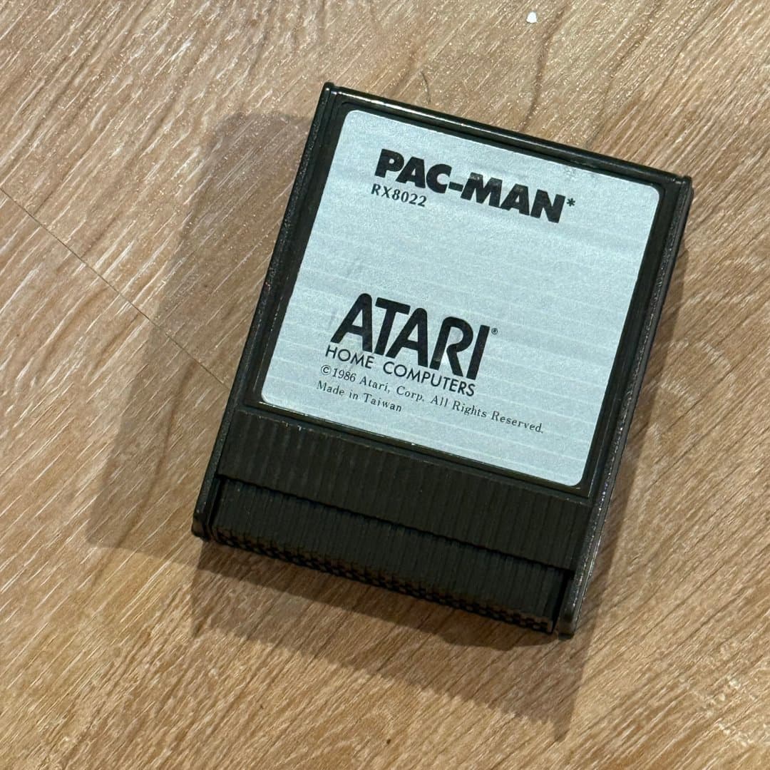Classic Pac-Man game cartridge for Atari Home Computers, released in 1986.