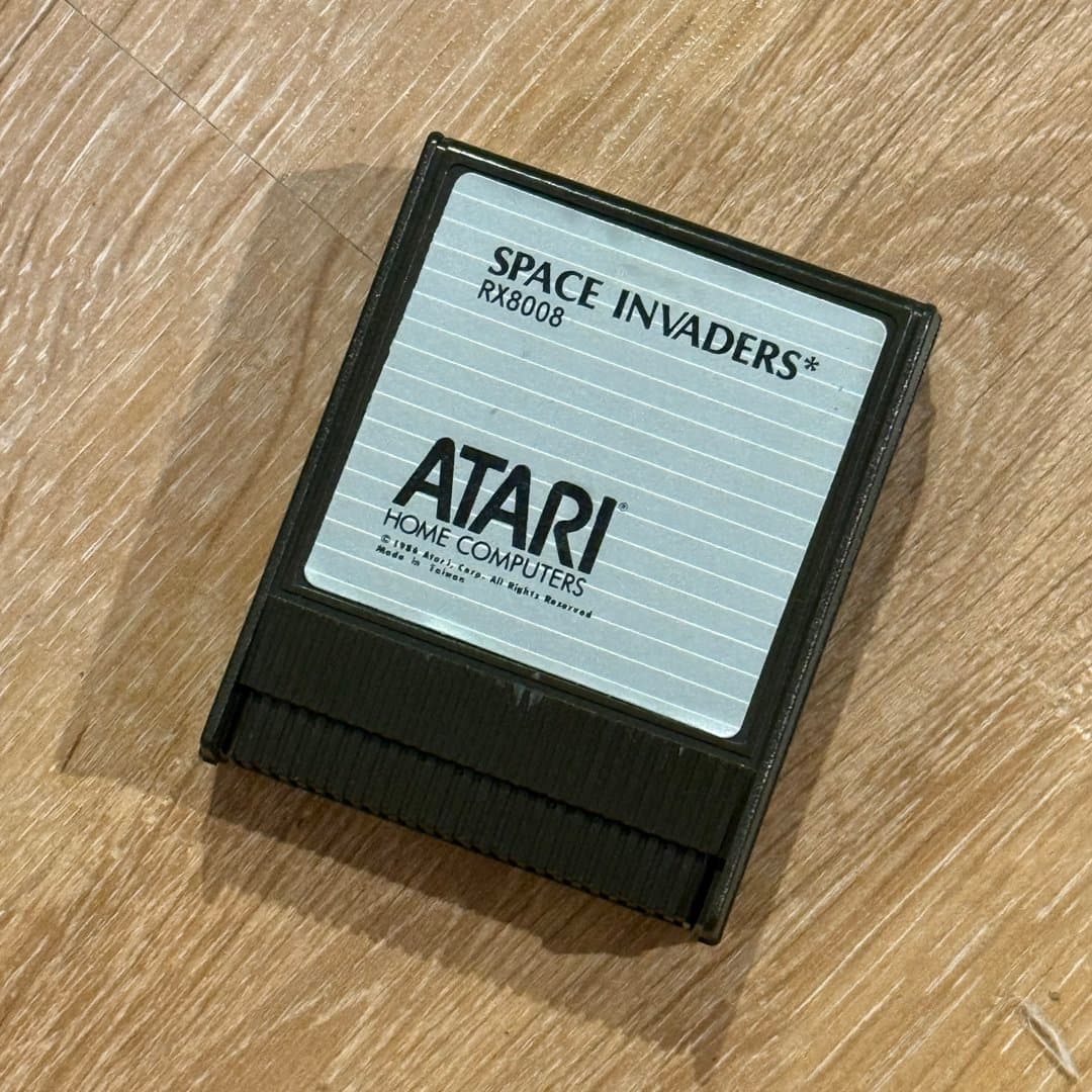 A vintage Atari Space Invaders game cartridge for home computers, copyright 1986.