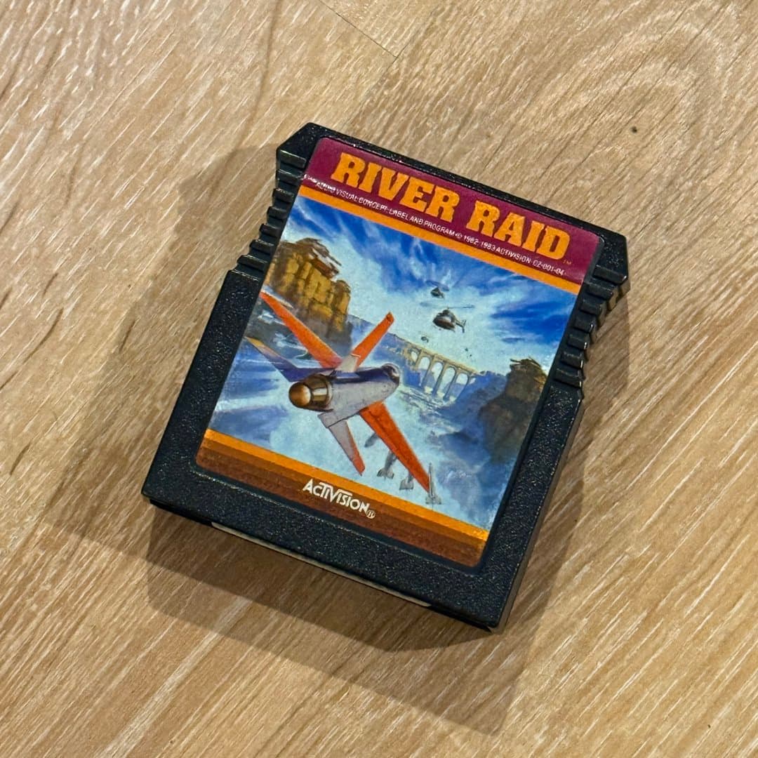 Classic Activision River Raid video game cartridge, a vintage Atari 2600 shooter.
