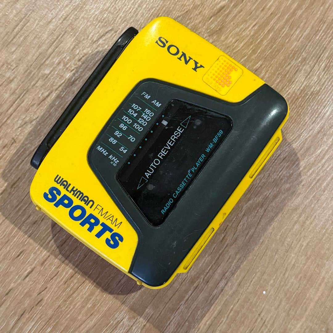Classic yellow Sony Walkman Sports WM-BF59 FM/AM radio cassette player with auto reverse.