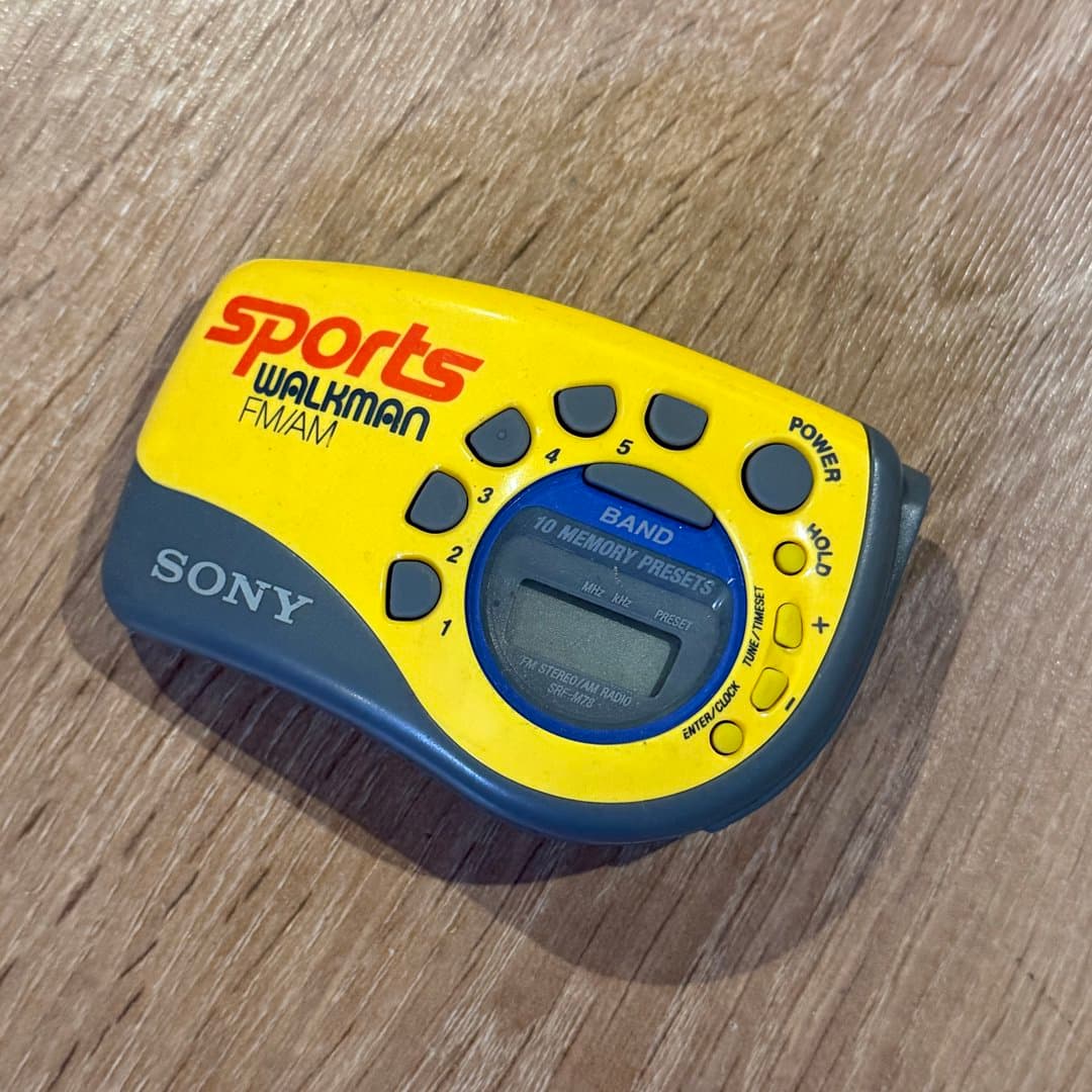 A vintage Sony Sports Walkman FM/AM radio, model SRF-M78, with memory presets.