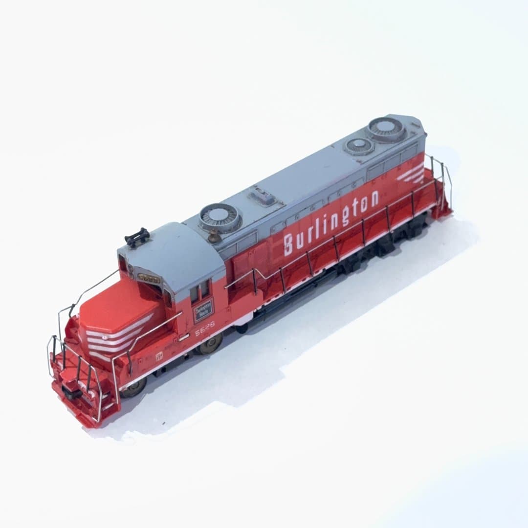 Red and gray Burlington Route Tyco model train locomotive, number 5628.
