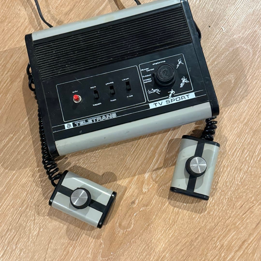 Retro TELETRANS TV SPORT video game console with built-in Pong-style games and paddle controllers.