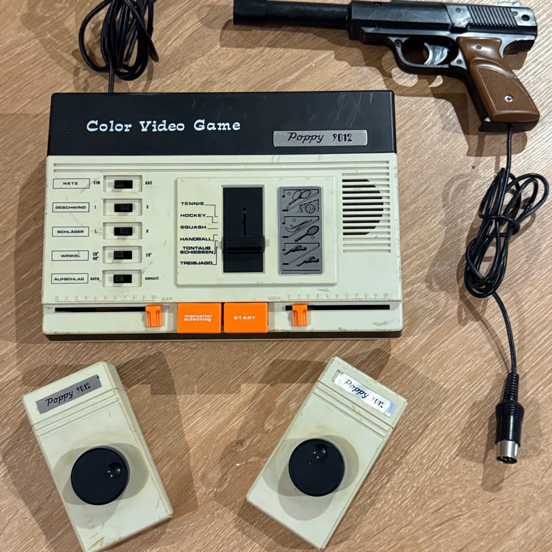 Vintage Poppy 9012 Color Video Game console with paddle controllers and light gun.