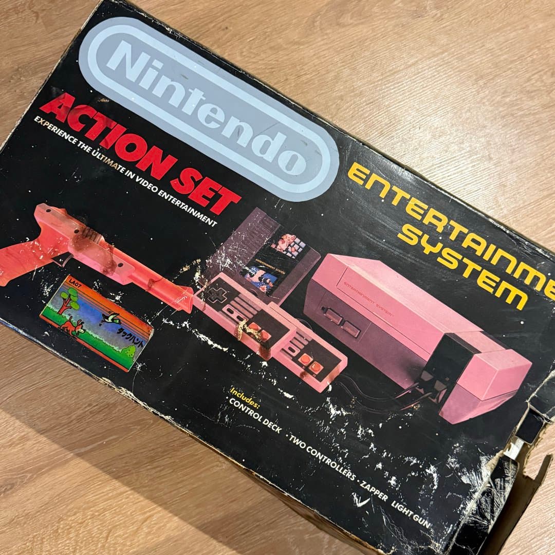 Vintage Nintendo NES Action Set console with Zapper light gun and Duck Hunt game.