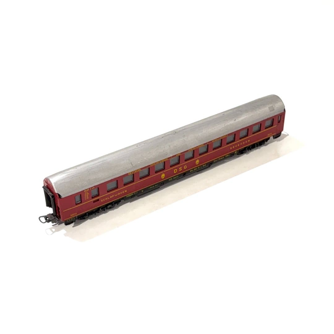 Lima Detailed model of a vintage red and silver DSG sleeping and dining train car.