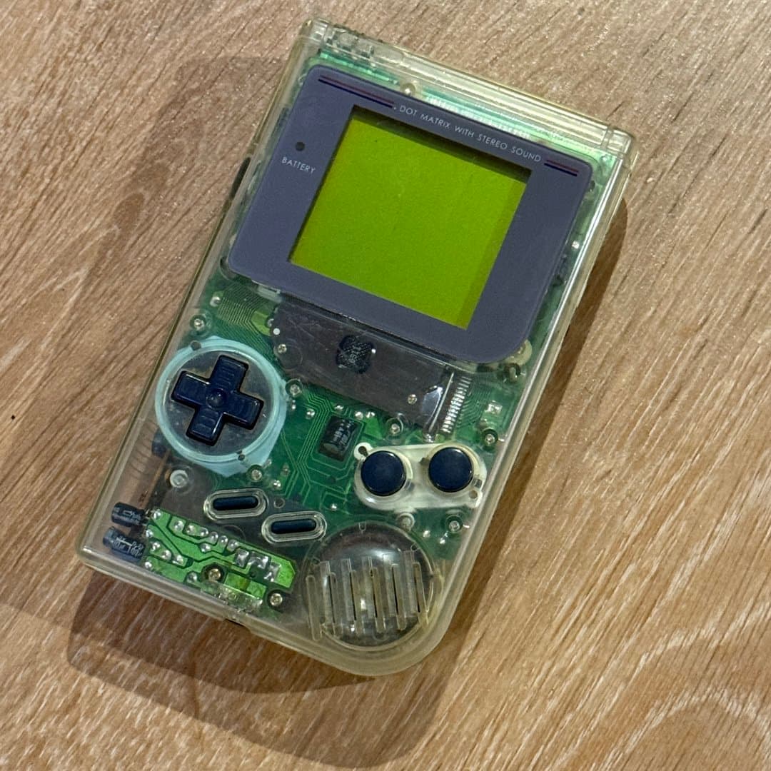 Transparent Nintendo Game Boy Color handheld console, a classic retro gaming device. - Photo 1