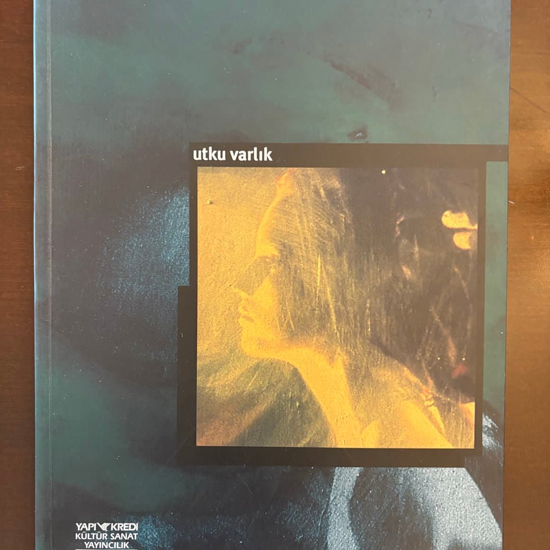 Artistic book 'utku varlık' by Yapı Kredi Kültür Sanat Yayıncılık, featuring a profile image. - Photo 1