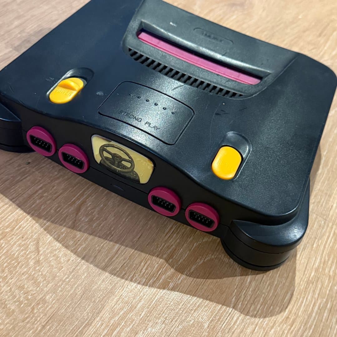 Famiclone - Nintendo 64 gaming console with yellow power/reset buttons and pink controller ports. - Photo 1