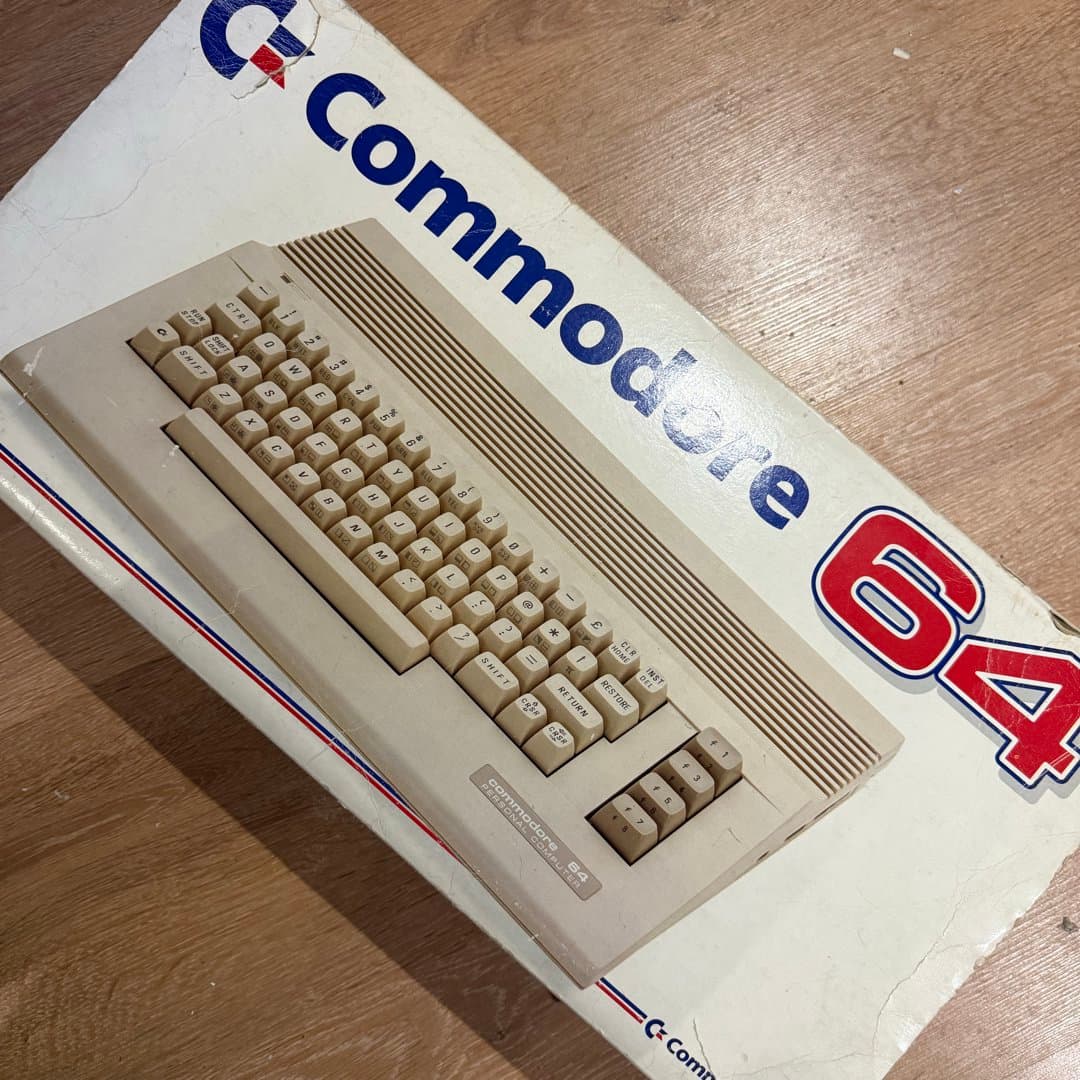Vintage Commodore 64 personal computer in its original box, an iconic 8-bit home computer. - Photo 1