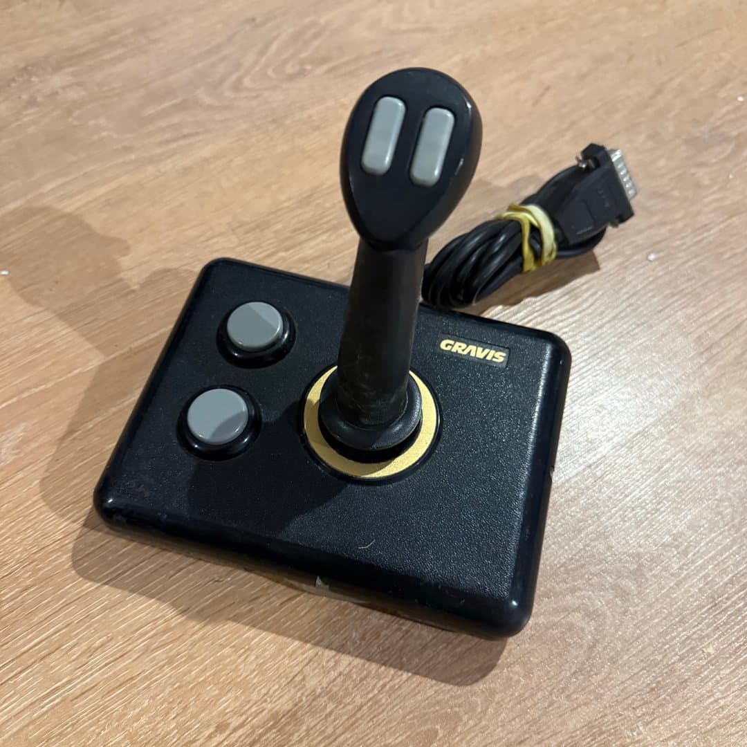 Retro Gravis PC joystick for classic computer gaming with a DA-15 connector.