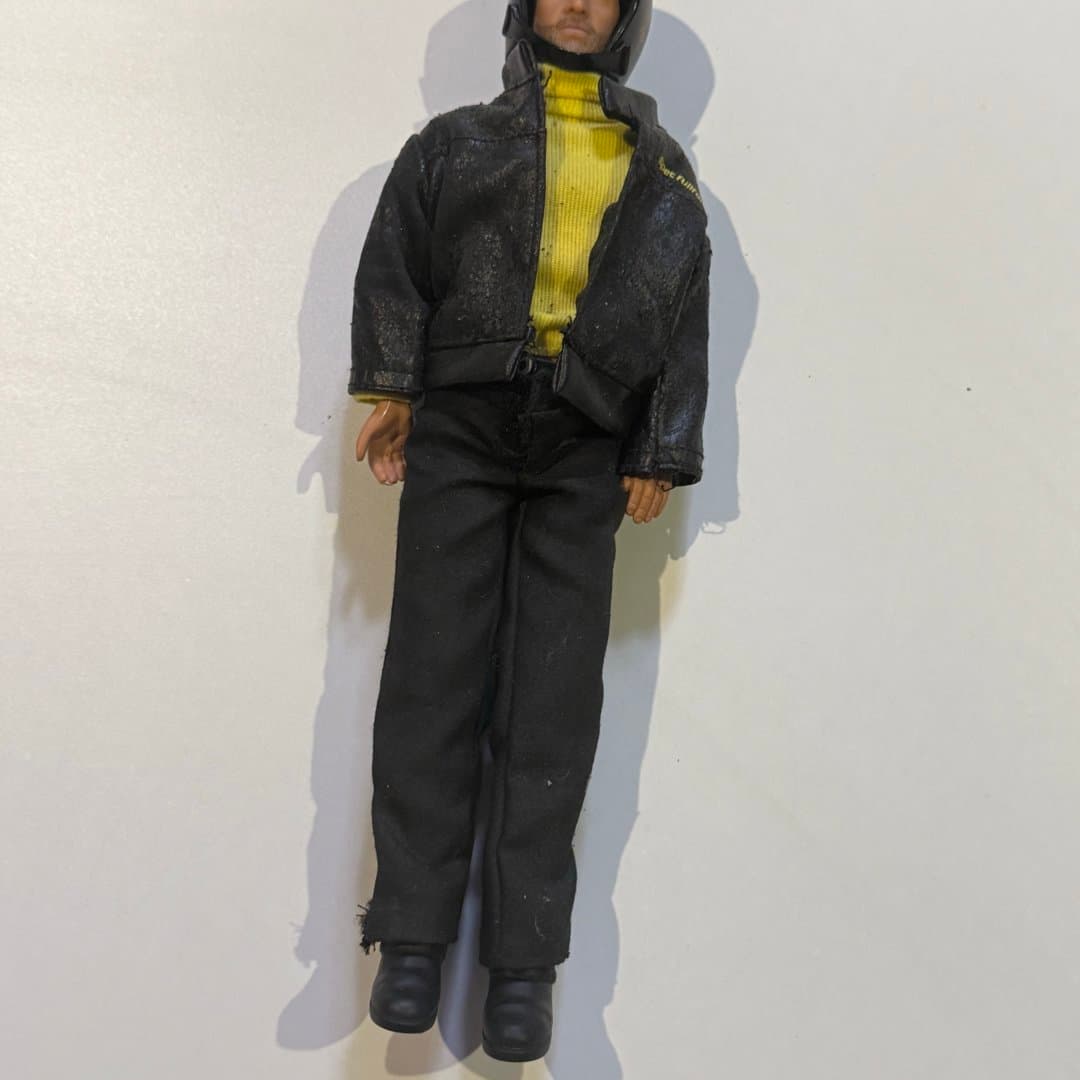 Mike Bebek - Cem Yılmaz (Opet) : Vintage action figure wearing a black jacket, yellow turtleneck, and motorcycle helmet.