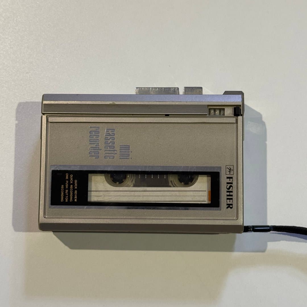 Vintage Fisher mini cassette recorder for quick audio recording and review.
