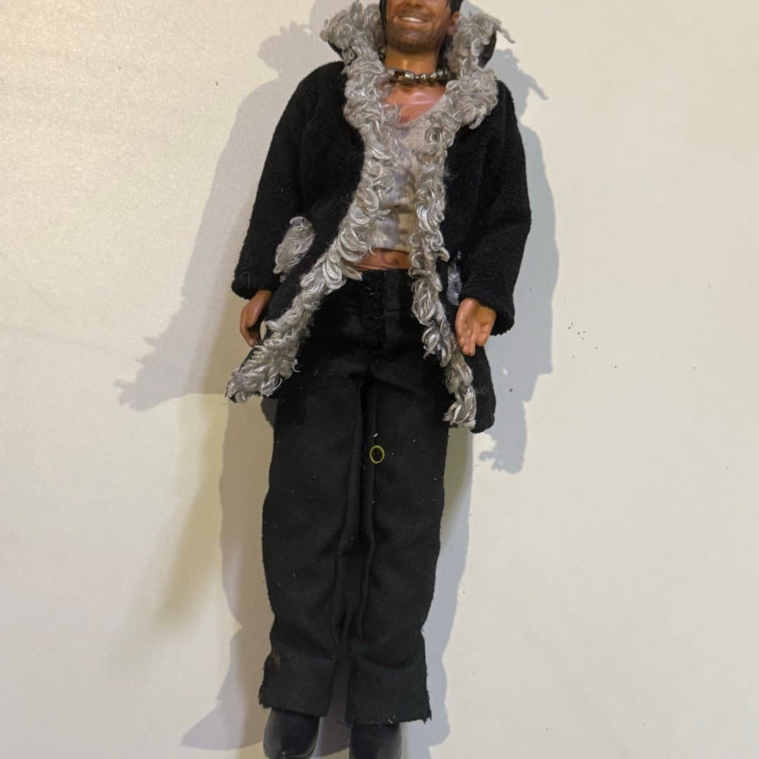 Mike Bebek - Cem Yılmaz (Opet) : Vintage action figure wearing a black jacket, yellow turtleneck, and motorcycle helmet.