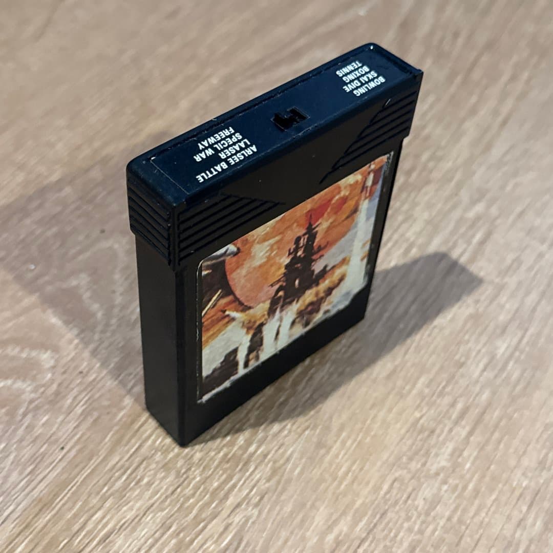 Retro Atari 2600 multi-game video game cartridge featuring classic titles like Bowling, Boxing, and Freeway.