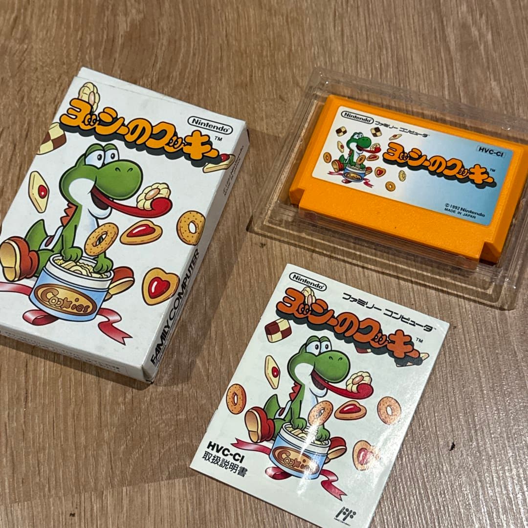 Yoshi no Cookie Famicom game box featuring Yoshi eating cookies.
