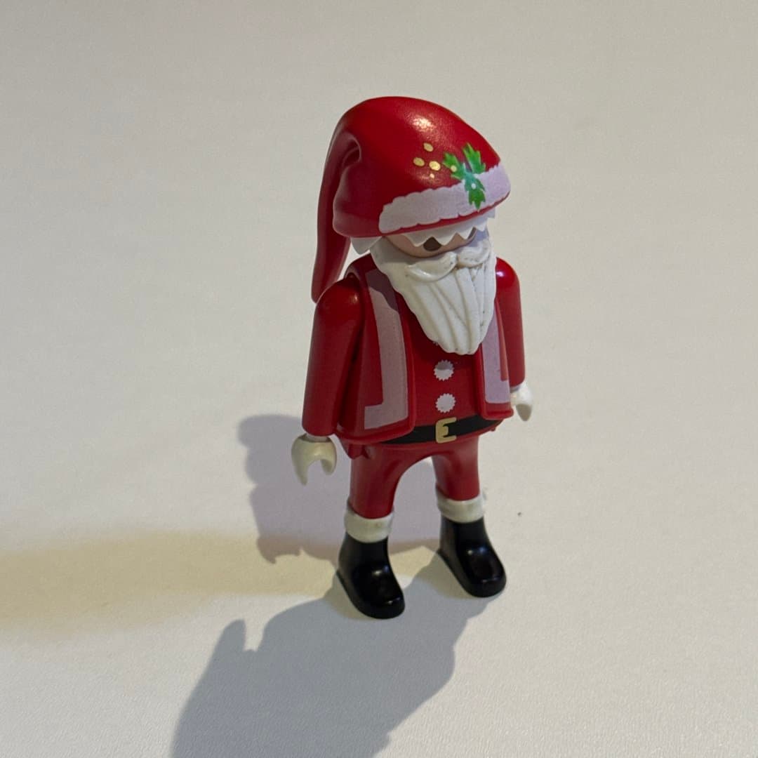 A vintage 2000 Playmobil Geobra Santa Claus figure, red suit with white trim and black boots.