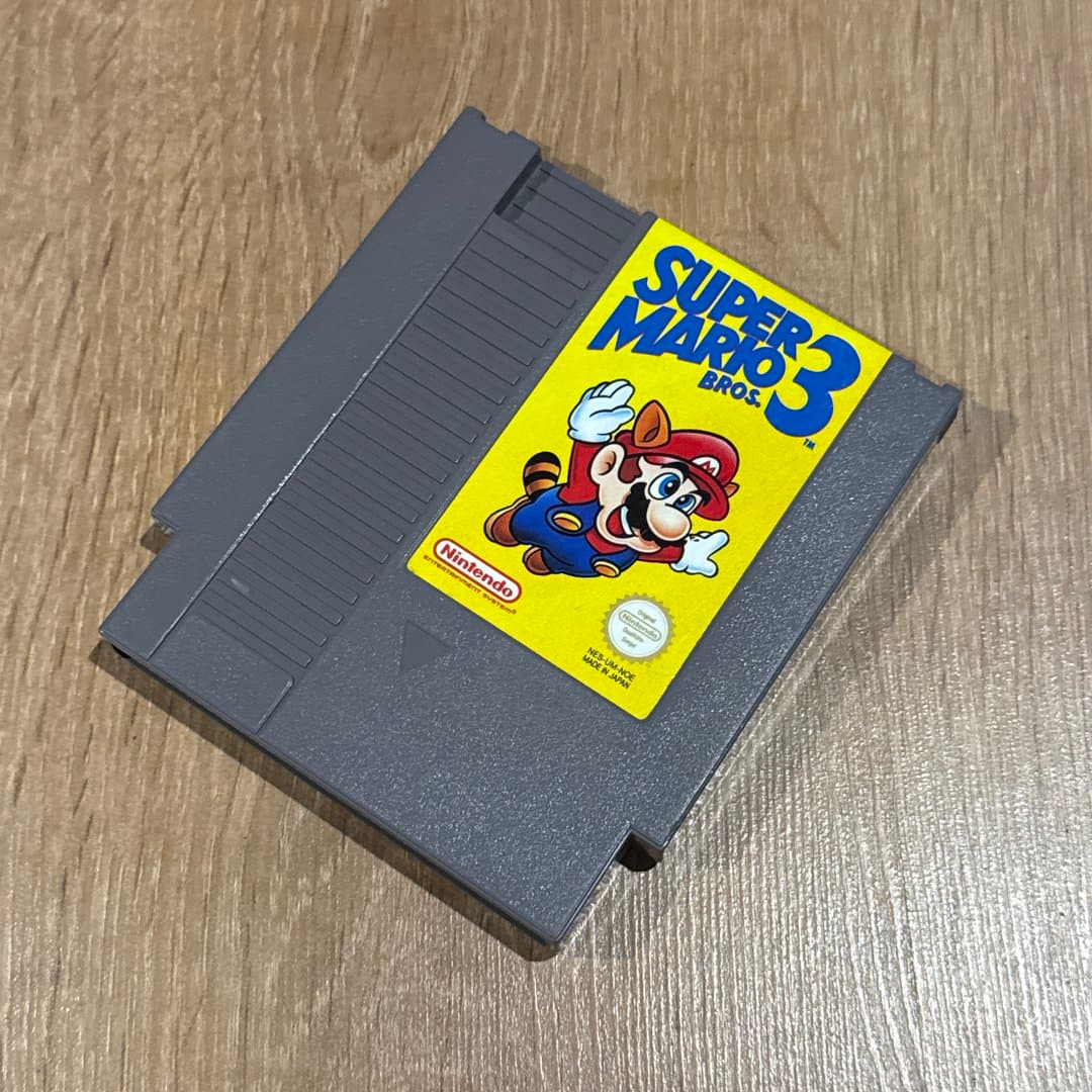 Classic Super Mario Bros. 3 NES game cartridge, a retro gaming essential. - Photo 1