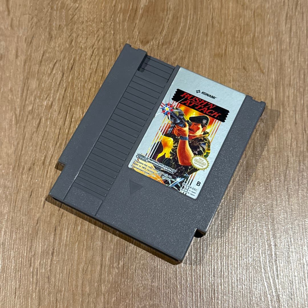 Rush'n Attack NES game cartridge by Konami, a classic 8-bit action title. - Photo 1