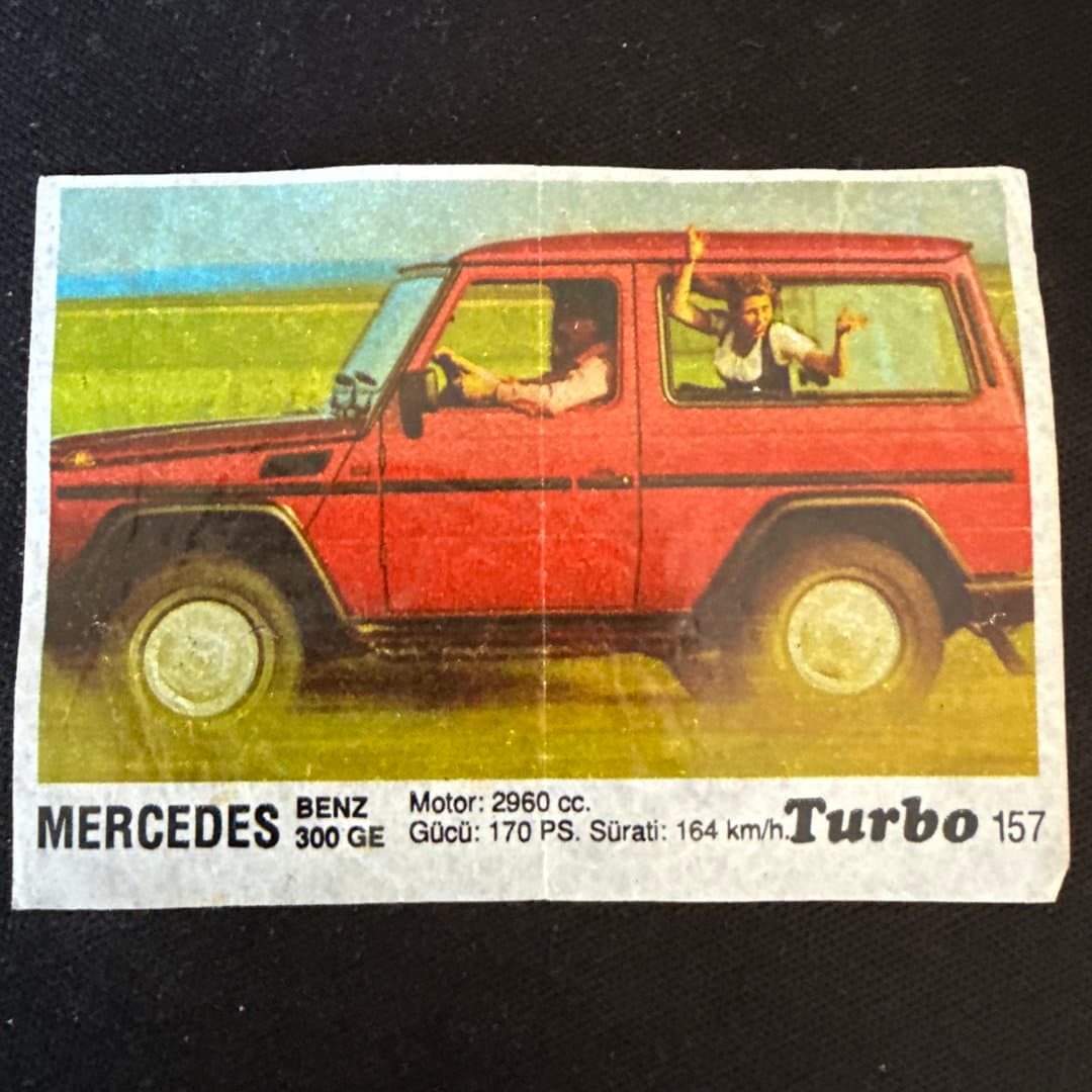 Vintage Mercedes-Benz 300 GE G-Wagen sticker/card with specs, featuring a red SUV. #157