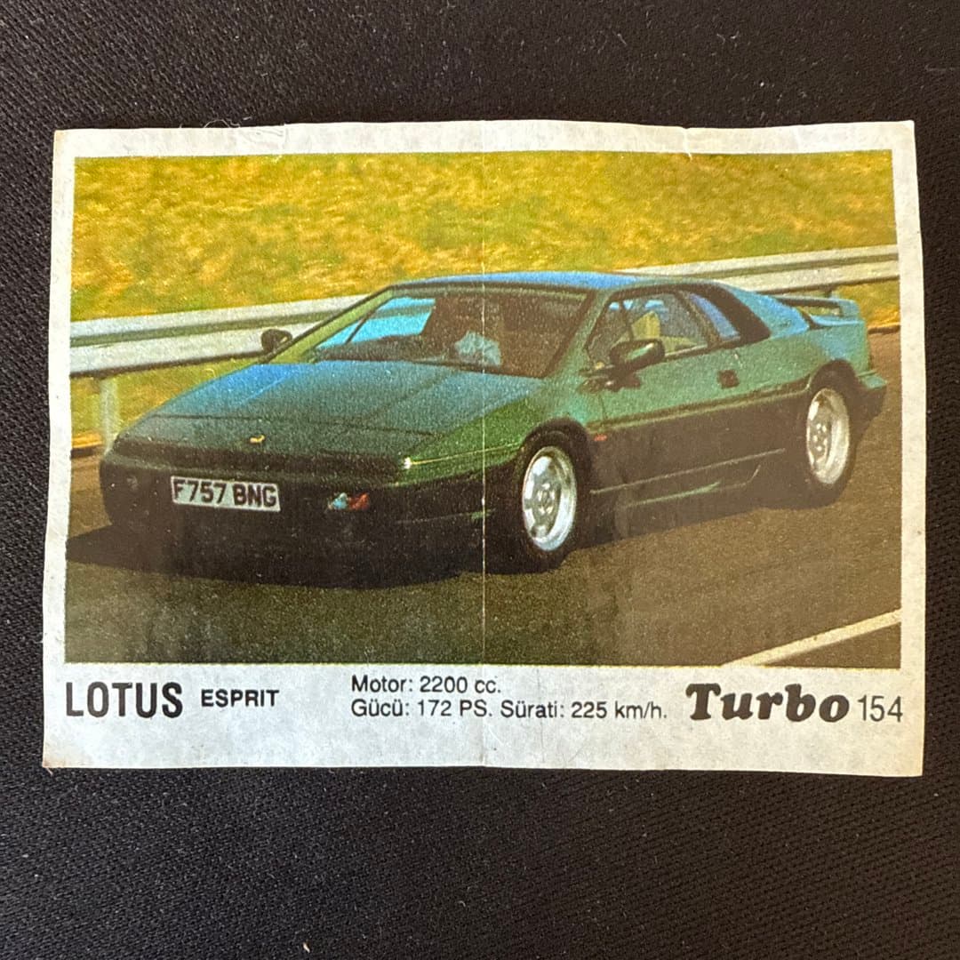 Vintage Lotus Esprit Turbo trading card featuring a green sports car with specs. #154